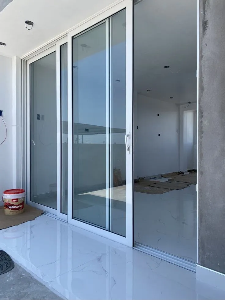 White uPVC sliding patio doors installed at a residence