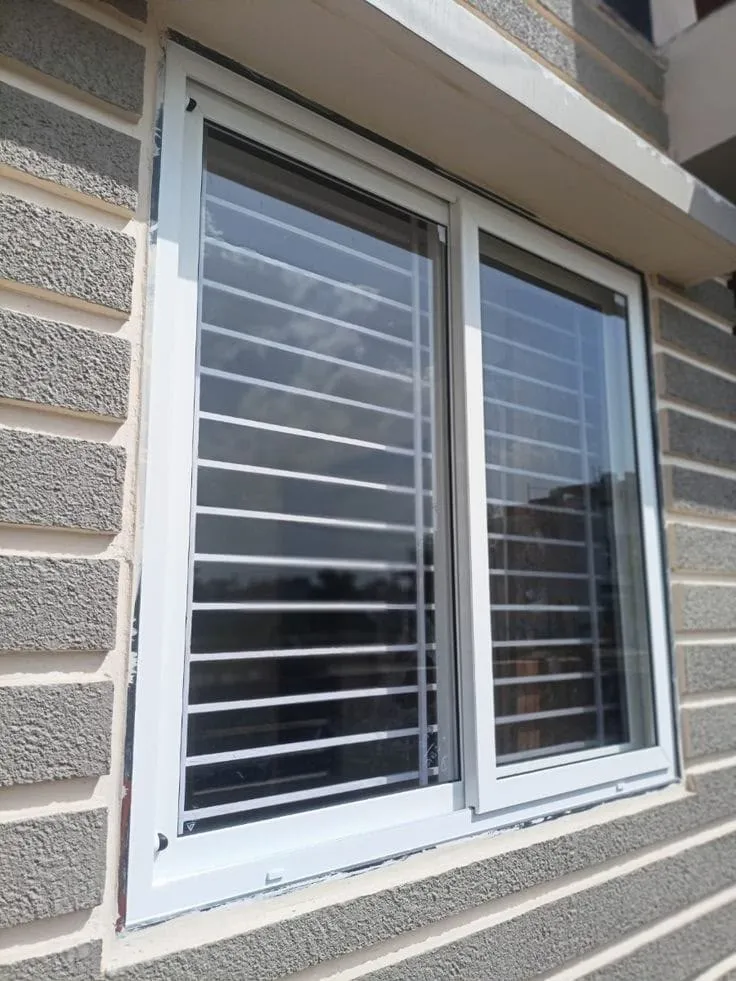 uPVC sliding window with safety grill installed